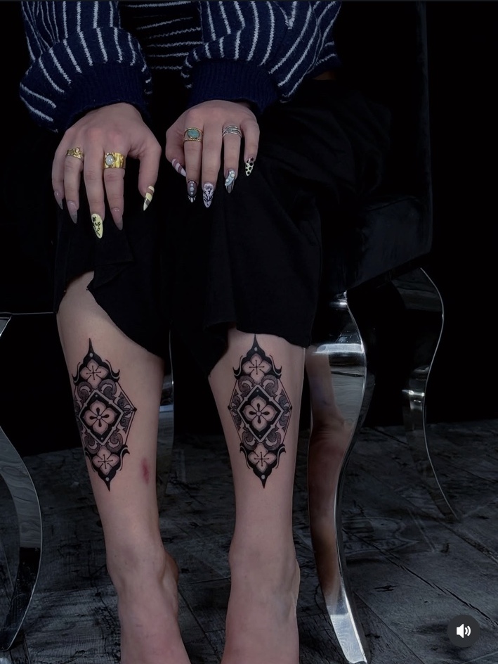 Paired ornamental calf tattoos by Digo